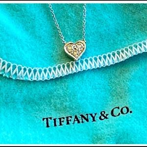 Tiffany & Co. White gold / diamond heart necklace